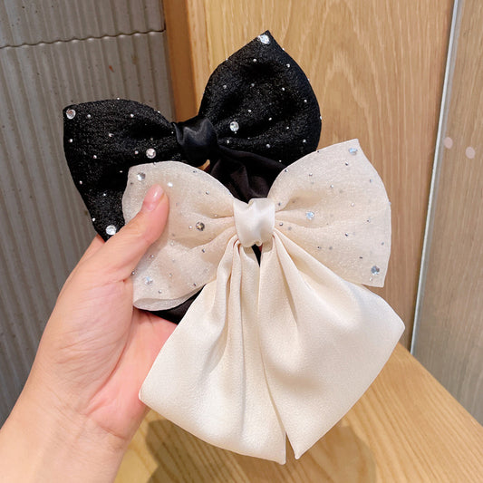 moño blanco y negro con perla, codigo a56