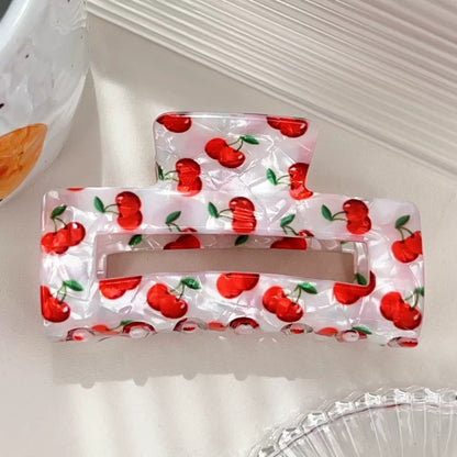 Pinza fresa y cereza de acrilico, con hueco en medio, codigo a100bis