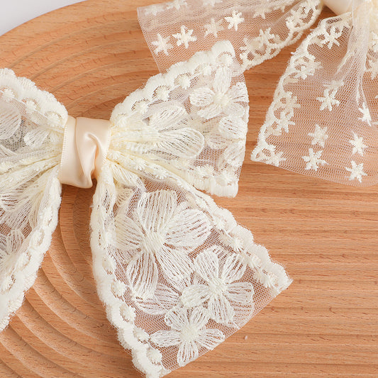 moño blanco y negro de encaje, codigo a274