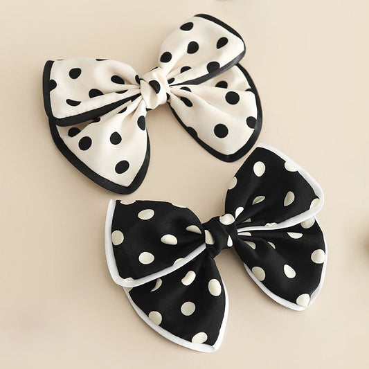 Moño blanco y negro mediano con bolitas, codigo a54